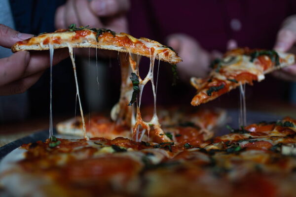 HD-wallpaper-person-picking-sliced-pizza